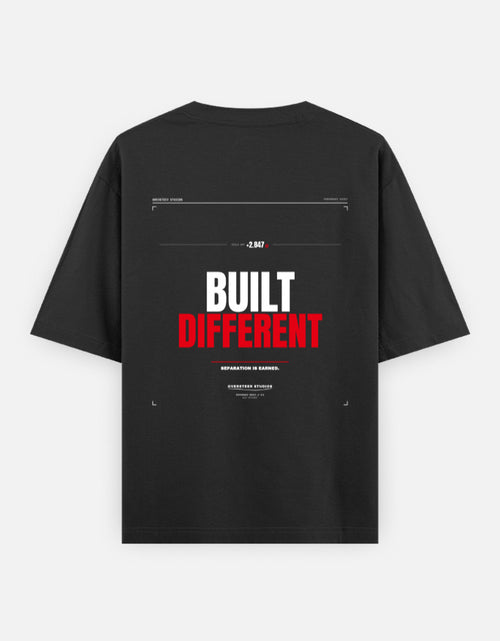 Built Different oversized black t-shirt by Oversteer Studios featuring a bold performance-inspired graphic with a minimalist technical design.
